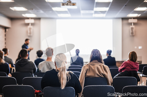 Image of Conference and Presentation. Audience at the conference hall. Business and Entrepreneurship. Faculty lecture and workshop. Audience in the lecture hall. Academic education. Student making notes