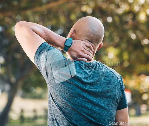 Image of Neck pain, outdoor and man in a park with sport injury and muscle strain from fitness and workout. Exercise problem, male person and back with medical, health and problem from training accident