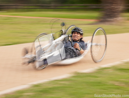 Image of Fast, disability and fitness with man and bike with handicap for training, sports and challenge. Exercise, workout and wheelchair with disabled person cycling in park for cardio, wellness and health