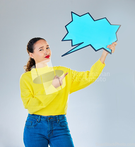 Image of Speech bubble, confused and woman pointing to chat, social media opinion and confused for translation in portrait. Gen z person with doubt, question and language mockup or quote on studio background