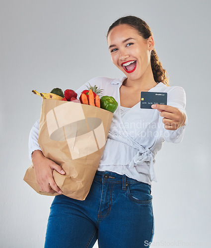 Image of Credit card, portrait and woman grocery shopping online for fruits in studio isolated on a white background. Sustainable bag, food and excited customer with digital money, ecommerce and fintech sales