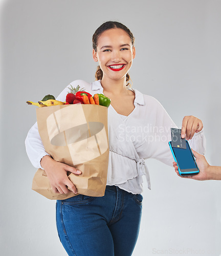 Image of Card machine, groceries and woman in portrait for POS, shop payment and fintech or digital finance. Grocery shopping, credit and cashier hands, people and food bag, point of sale on studio background