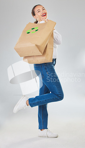 Image of Recycling, environment and woman with bag, sustainability with shopping isolated on white background. Environmental, retail and eco friendly, female person and sustainable development in studio