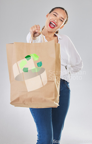 Image of Recycling, environment and happy woman with bag, carbon footprint and sustainability with shopping on white background. Environmental, retail and eco friendly, female person excited in studio