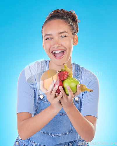 Image of Happy, health and portrait of woman with fruit in studio for healthy eating, wellness and diet. Food, lose weight and female person on blue background with apple, orange and banana for nutrition