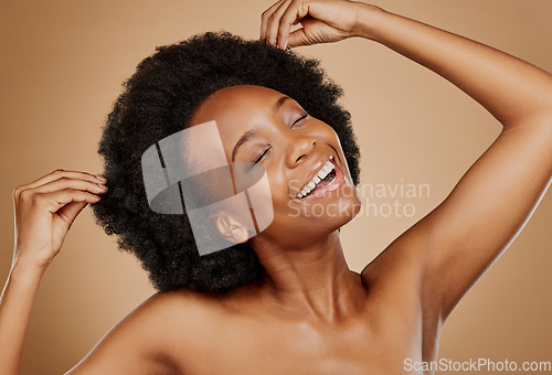 Image of Hair care, beauty and black woman with luxury, smile and wellness against a brown studio background. Female person, model and girl with happiness, dermatology and cosmetics with grooming and shampoo