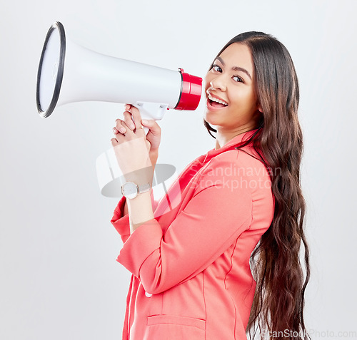 Image of Portrait, megaphone or happy woman with announcement on a white background for speech or review. Smile, attention or voice of girl with news or broadcast of opinion on mockup space talking on speaker