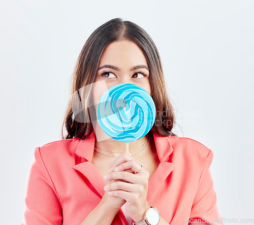 Image of Thinking, lollipop and woman with ideas, sweets and happiness against a white studio background. Decision, female person and model with candy, dessert and treats with fantasy, choice and creativity