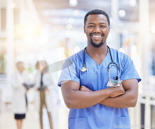 Image of Portrait, nurse and black man with arms crossed, smile and healthcare in hospital. Medical professional, face and confident surgeon, African doctor or worker with pride for career, job and wellness