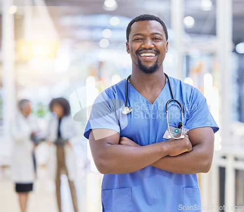 Image of Portrait, nurse and black man with arms crossed, healthcare and happy in hospital. African doctor, face and confident surgeon, medical professional or worker with pride for career, job and wellness.