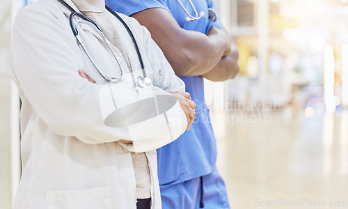 Image of Hands, doctors and team with arms crossed in hospital, clinic and medical support. Closeup of people, expert collaboration or healthcare staff ready for service with pride, help and trust in medicine