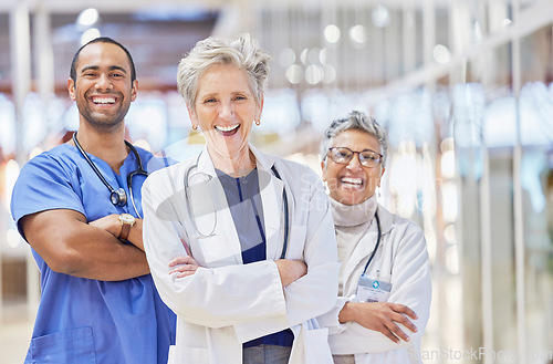 Image of Portrait, doctors and team arm crossed for healthcare service, leadership and success in hospital or clinic. Happy, laugh and face of professional medical woman, mentor and internship nurse in group