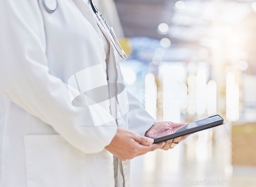 Image of Doctor, hands and person with tablet for medical information, data research or healthcare in hospital. Closeup of physician, digital technology and planning telehealth, internet app or online results