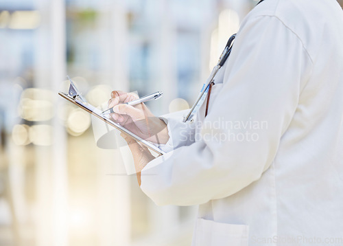 Image of Hands, person or doctor writing on clipboard, documents or administration of healthcare schedule. Closeup of medical worker, pen or report of insurance checklist, contract or paper script in hospital