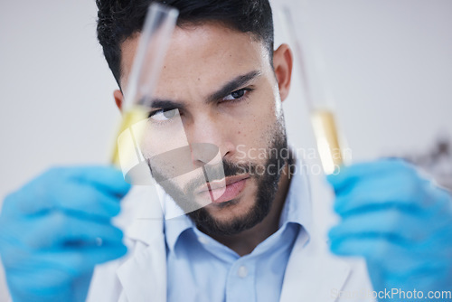 Image of Science, test tube and man thinking of research, vaccine solution and data analysis in laboratory investigation. Healthcare, medical scientist or young person focus for medicine or liquid comparison