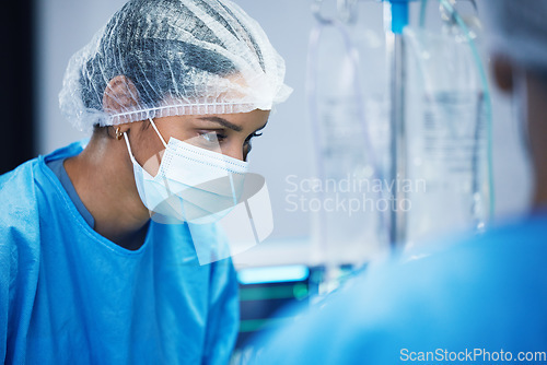 Image of Theatre, team and surgeon woman or doctors of medical support, hospital or healthcare solution in face mask. Focus, thinking and nurses in surgery, operating room and emergency or life insurance help