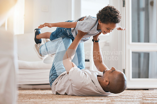 Image of Kid, father and plane game on floor with smile, bonding and love in living room, family home and care. Man, body child and together for playing, airplane and excited on carpet in lounge with lifting