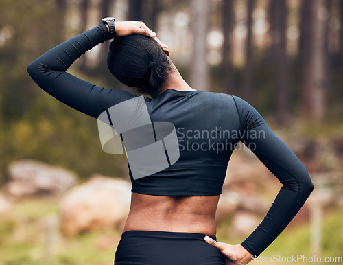 Image of Exercise, stretching neck and back of woman in nature for fitness, training and sports in forest. Healthy body, mountain and female person getting ready with warm up, cardio workout and wellness
