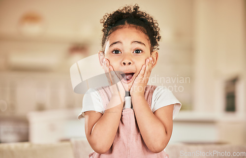 Image of Wow portrait, reaction and a child in a house for news, announcement or excited. Shock, lounge and a young girl with a surprise expression a home living room for achievement or communication