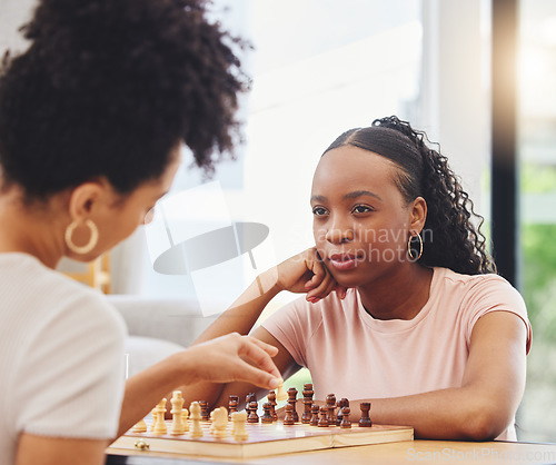 Image of Chess, friends and women with board for game moving piece for strategy, thinking and challenge. Competition, planning and African female people with chessboard in living room playing to checkmate