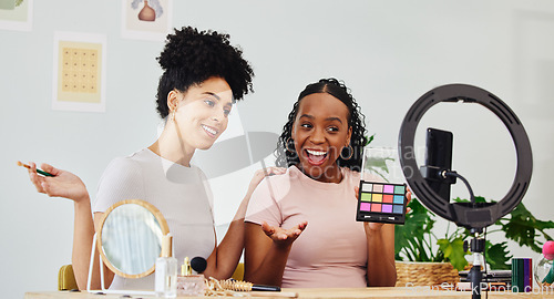 Image of Vlogging, friends and women doing a makeup tutorial together with technology for social media, Happy, fun and young interracial female people filming a cosmetic, beauty or face routine on a phone,