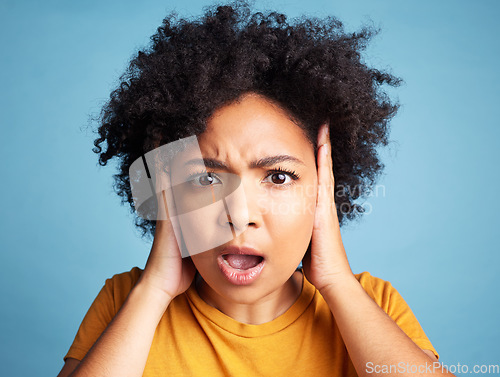 Image of Surprise, wow and portrait of a woman with anxiety, bipolar or mental health problem. Shock, fear and face of a young girl with scared or panic expression and isolated on a blue background in studio