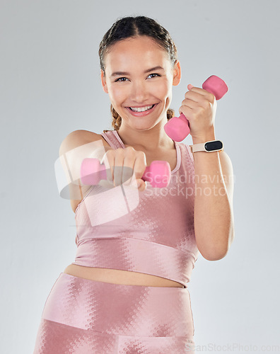 Image of Fitness, portrait and woman with dumbbell isolated on studio white background for health, exercise and gym power. Bodybuilder, face and sports person happy for workout goals and lose weight training