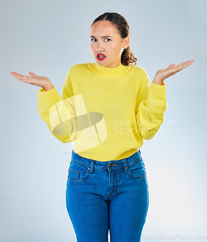 Image of Portrait, shrug and woman confused, question and decisions against a white studio background. Female person, girl and model with confusion, why and i dont know with emoji, puzzle and choice doubt