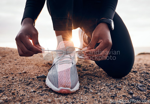 Image of Shoes, fitness and person typing laces ready for outdoor exercise, workout or hiking for health and wellness. Hands, closeup and athlete or runner prepare for marathon training or endurance running