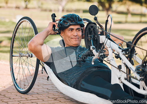 Image of Sports, athlete or a man with a disability and bike for handicap race, fitness and recumbent challenge. Exercise, happy and a handbike of Paralympic person outdoor for cycling or cardio for training