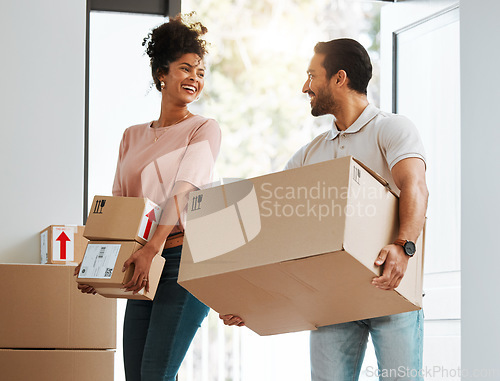 Image of Couple, box and excited in new home, happy or together for moving, beginning and commitment for mortgage. Man, woman with cardboard package, smile or start life in property, real estate and apartment