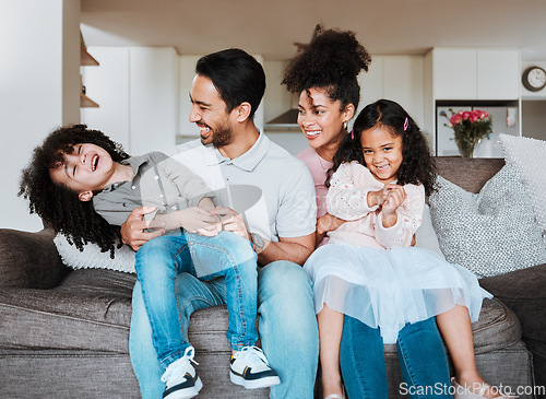 Image of Mom, dad and children on sofa, playing and happy family bonding together in living room in Mexico. Smile, happiness and parents relax with kids on couch, quality time and fun in new home or apartment