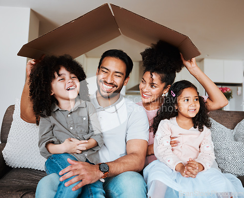 Image of Sofa, parents and kids with cardboard roof and happy family together in living room of new home. Property, happiness and mom, dad and children on couch, mortgage and insurance with future security.