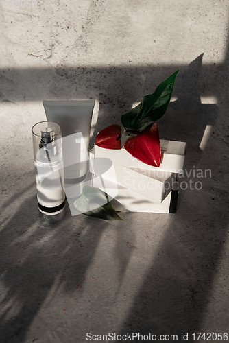 Image of Cosmetic bootles with flowers