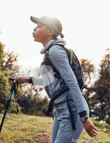 Image of Hiking, fitness and black woman in nature walking for exercise, cardio workout and adventure in woods. Sports, endurance and female person trekking in forest for healthy body, wellness and freedom