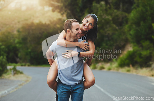 Image of Piggyback, love or happy couple walking on road or date with smile for romance, summer or adventure. Portrait, trust or man with woman on holiday vacation for bond, support or wellness on street
