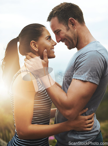 Image of Romance, love or happy couple in nature outdoor date with loyalty for commitment, care or respect. Eye contact, trust or man with woman hug on holiday vacation for bond, support or wellness and flare