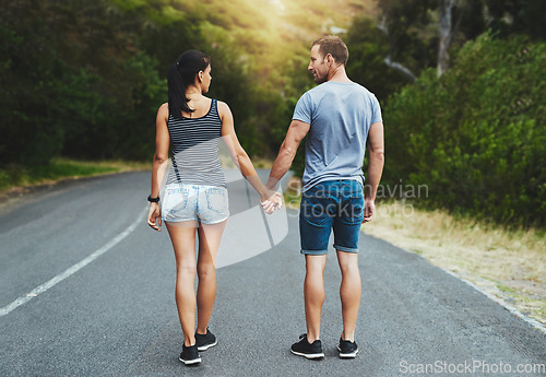 Image of Street, love or happy couple holding hands or walking on date with trust, care for romance or adventure. Loyalty, road or man with woman on holiday vacation together for bond, support or wellness