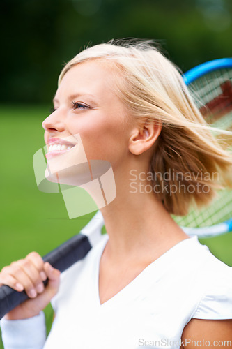 Image of Tennis, woman and smile with racket outdoor for training to play match, contest and competition. Face of happy young athlete, sports player and thinking on court about practice for tournament game