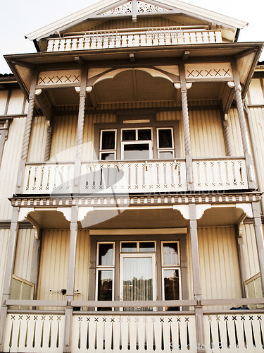 Image of Front, vintage wood building and house in Norway, apartment and property for travel, vacation and tourism. Retro wooden home, cottage and exterior of traditional architecture widow outdoor in Europe