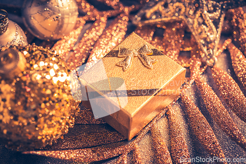 Image of Beautiful Christmas golden deco baubles with gifts, Happy New Year