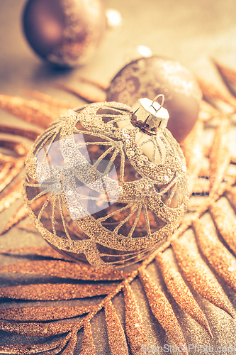 Image of Beautiful Christmas golden deco baubles with gifts, Happy New Year