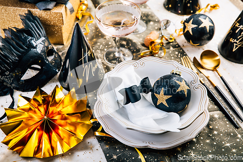 Image of Christmas And New Year Holiday Table Setting with Champagne. 