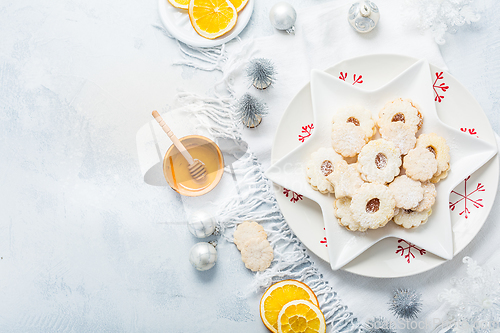 Image of Homemade Christmas cookies with orange and honey.  Christmas decoration with ornaments.