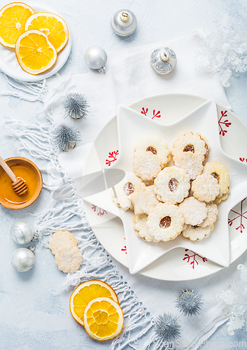 Image of Homemade Christmas cookies with orange and honey.  Christmas decoration with ornaments.
