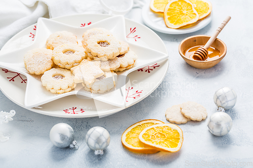 Image of Homemade Christmas cookies with orange and honey.  Christmas decoration with ornaments.