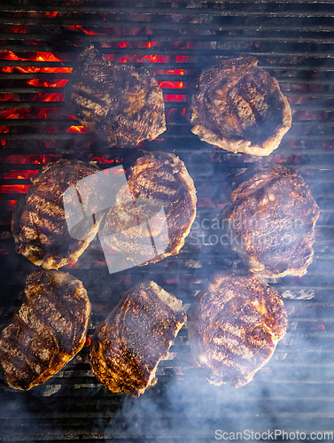 Image of Steaks are generously covered in seasoning