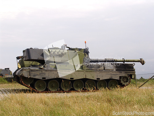 Image of Military, nature and soldier transportation on field for warzone with a missile weapon in camouflage. Vehicle, landscape and army patrol service with gun for outdoor battle with conflict on land.