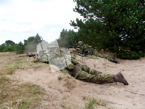 Image of Military, soldier and target with weapon and aim for fitness, battle or challenge outdoor with gear or hiding. Army, people and attack for workout, mission or bootcamp with camouflage for survival