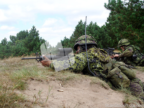 Image of Army, soldier and target with weapon and aim for fitness, battle or challenge outdoor with gear or hiding. Military, people and attack for workout, mission or bootcamp with camouflage for survival